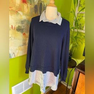 One piece but looks like collared shirt with sweater